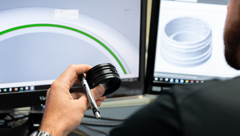 kaysun-engineer-reviewing-part