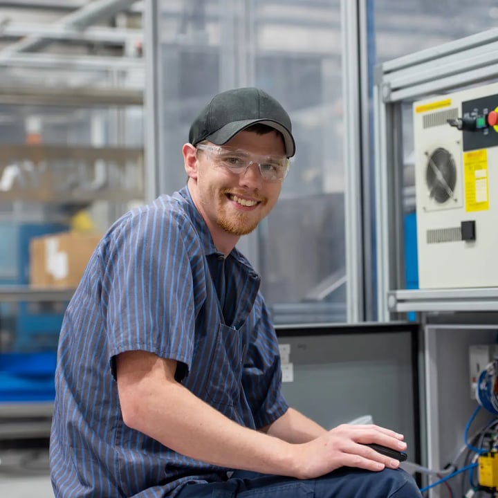 man inspecting machinery
